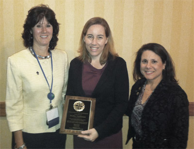 Photo of Heather Nachtmann with plaque and Kim Needy