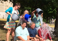 Photo of faculty members having ice buckets dumped on heads