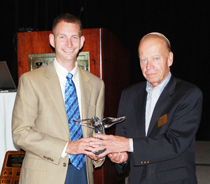 Photo of Russell Meller with award