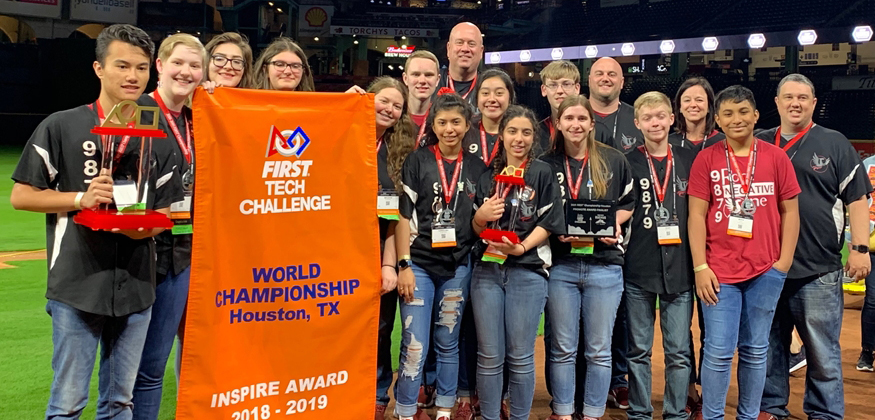 photo of student robotic team with national trophy